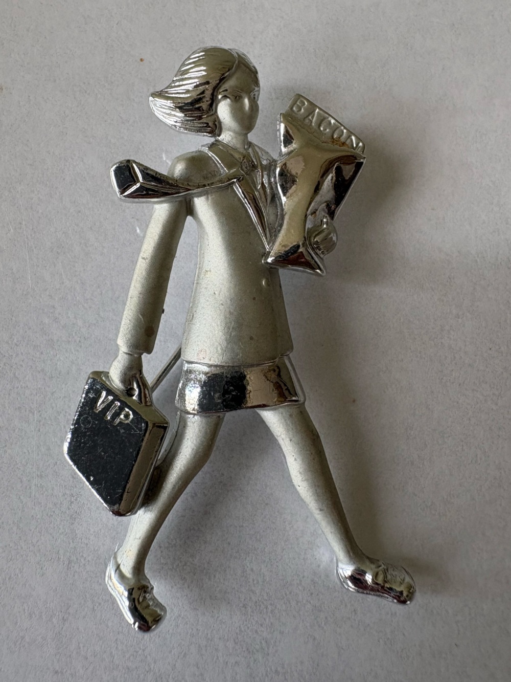 Silver career women business  brooch bringin home the bacon